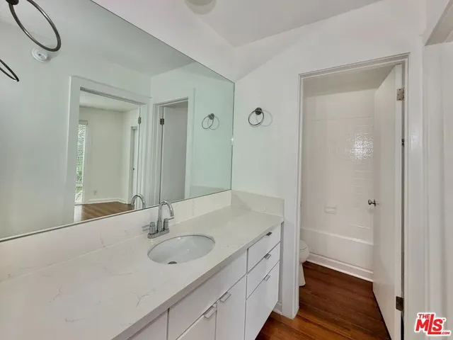a bathroom with a toilet and a bathtub