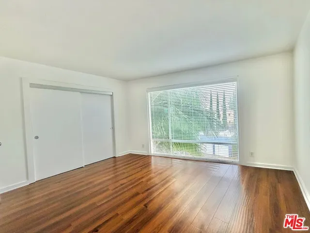 a bathroom with a granite countertop sink and mirror