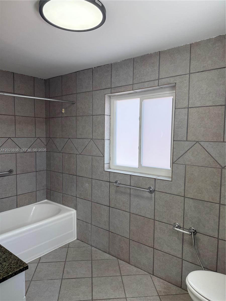 6312 Alton Road Miami Beach, FL 33140 - Photo 8 of 15 a bathroom with a bathtub