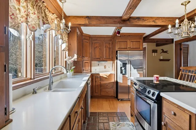 a kitchen that has a sink and a stove
