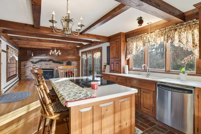 a kitchen with a table and chairs
