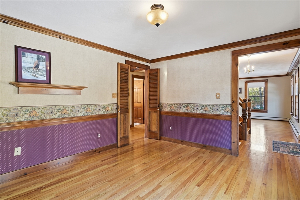 4 Thayer Road Monson, MA 01057 - Photo 20 of 40 a view of a livingroom with furniture a dinning room and wooden floor