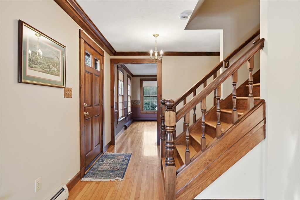 4 Thayer Road Monson, MA 01057 - Photo 21 of 40 a view of a hallway with wooden floor and stairs