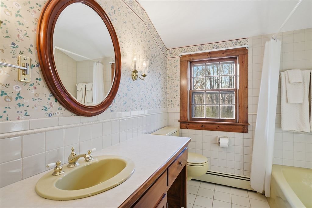 4 Thayer Road Monson, MA 01057 - Photo 22 of 40 a bathroom with a sink a mirror and a window