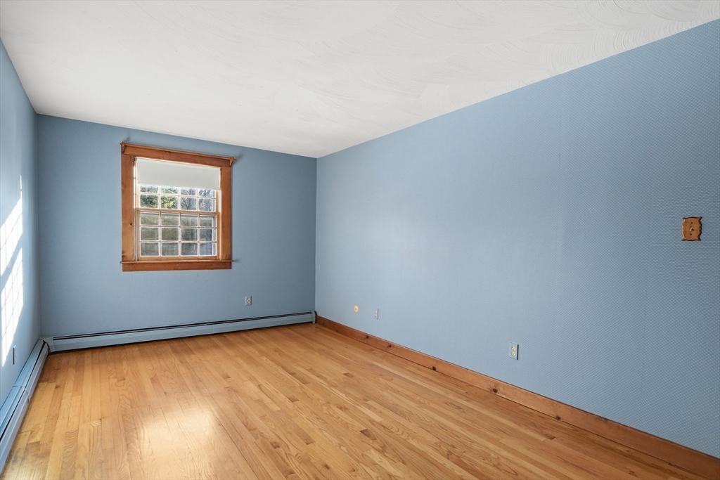 4 Thayer Road Monson, MA 01057 - Photo 23 of 40 an empty room with wooden floor and windows