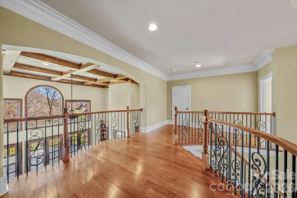 a view of hallway with wooden floor