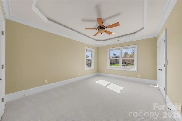 a view of empty room with windows