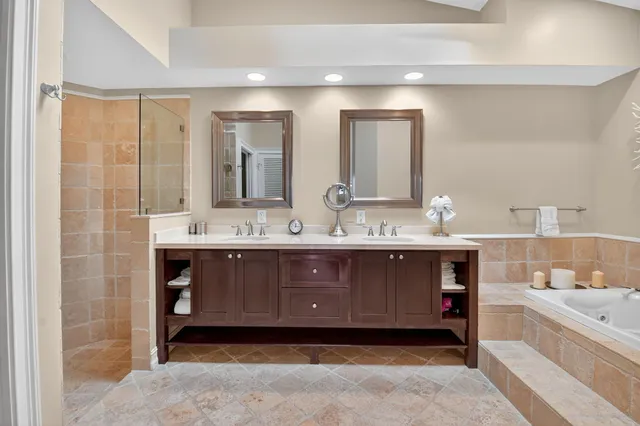 a view of a lake with houses in the background