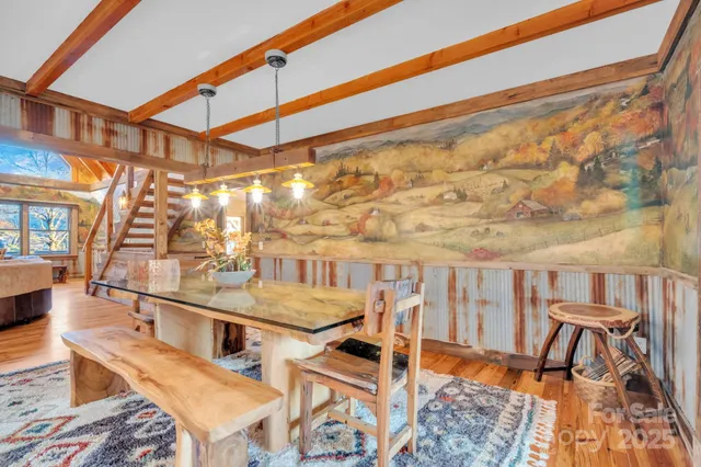 a view of a chair and tables in the balcony