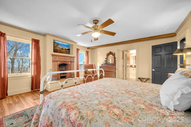 a spacious bathroom with a granite countertop sink a mirror and a shower
