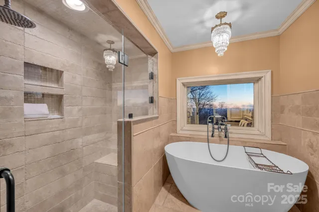 a view of a balcony with wooden floor and iron stairs