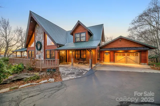 a view of a house with a yard and balcony