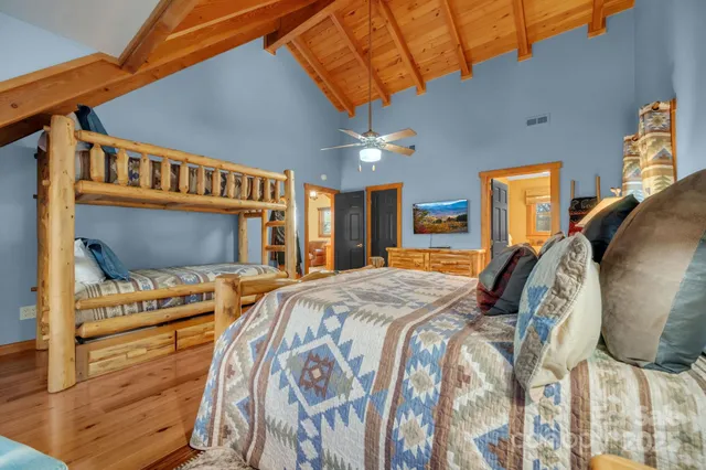 a bathroom with a sink a toilet and a large mirror