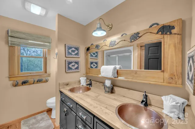 a hallway with wooden floor and furniture