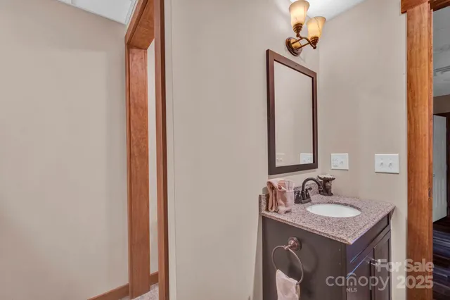 a view of a roof deck with couches and wooden floor