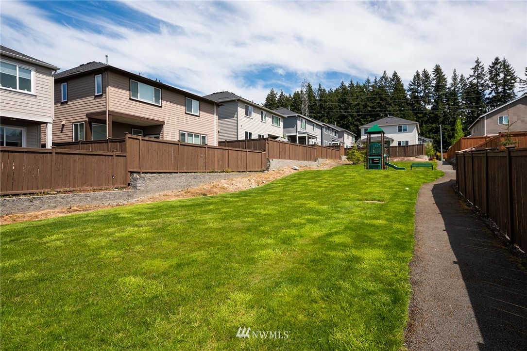 4113 172nd Place Southeast Bothell, WA 98012 - Photo 2 of 32 a front view of a house with a yard
