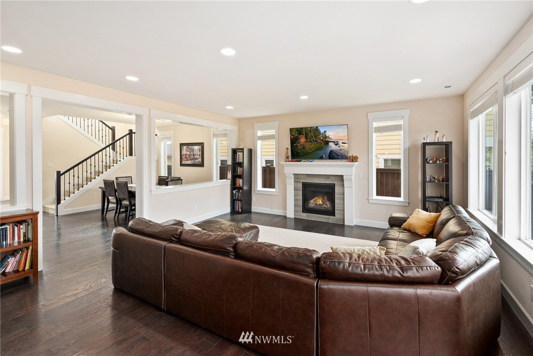 4113 172nd Place Southeast Bothell, WA 98012 - Photo 13 of 32 a living room with furniture and a fireplace