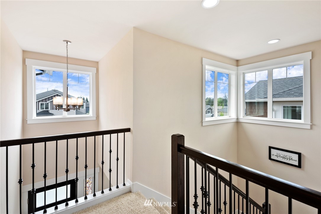 4113 172nd Place Southeast Bothell, WA 98012 - Photo 16 of 32 a view of a hallway with windows