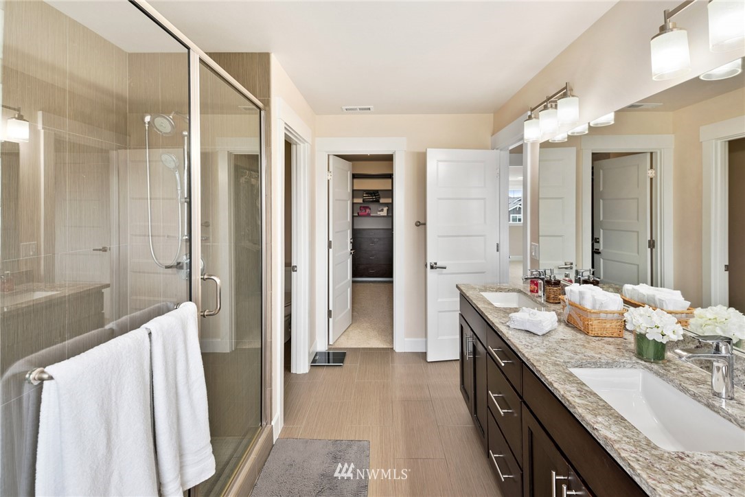 4113 172nd Place Southeast Bothell, WA 98012 - Photo 20 of 32 a spacious bathroom with a double vanity sink mirror and double