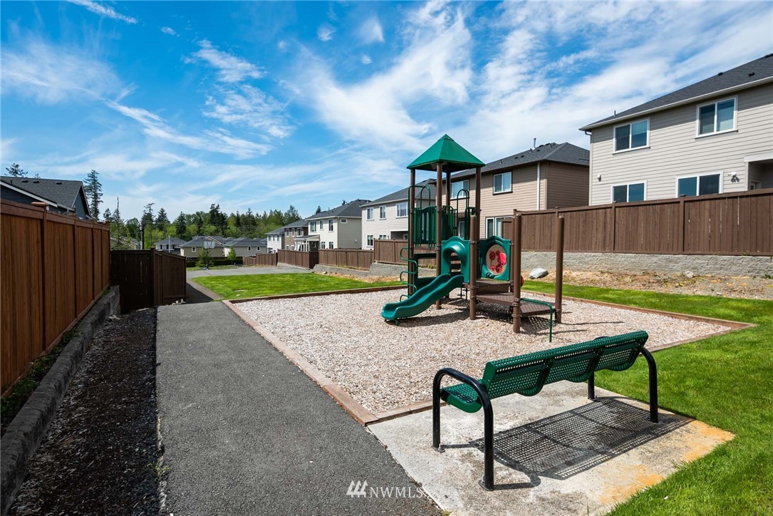 4113 172nd Place Southeast Bothell, WA 98012 - Photo 22 of 32 a front view of a house with garden