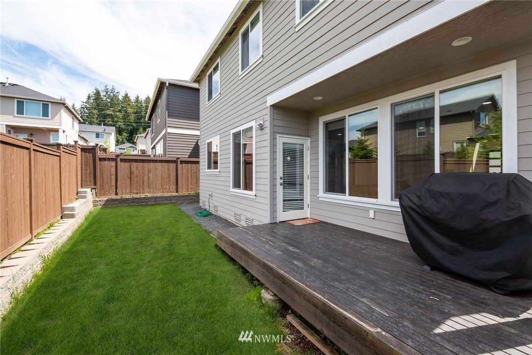 4113 172nd Place Southeast Bothell, WA 98012 - Photo 23 of 32 a view of a house with a small yard and wooden floor