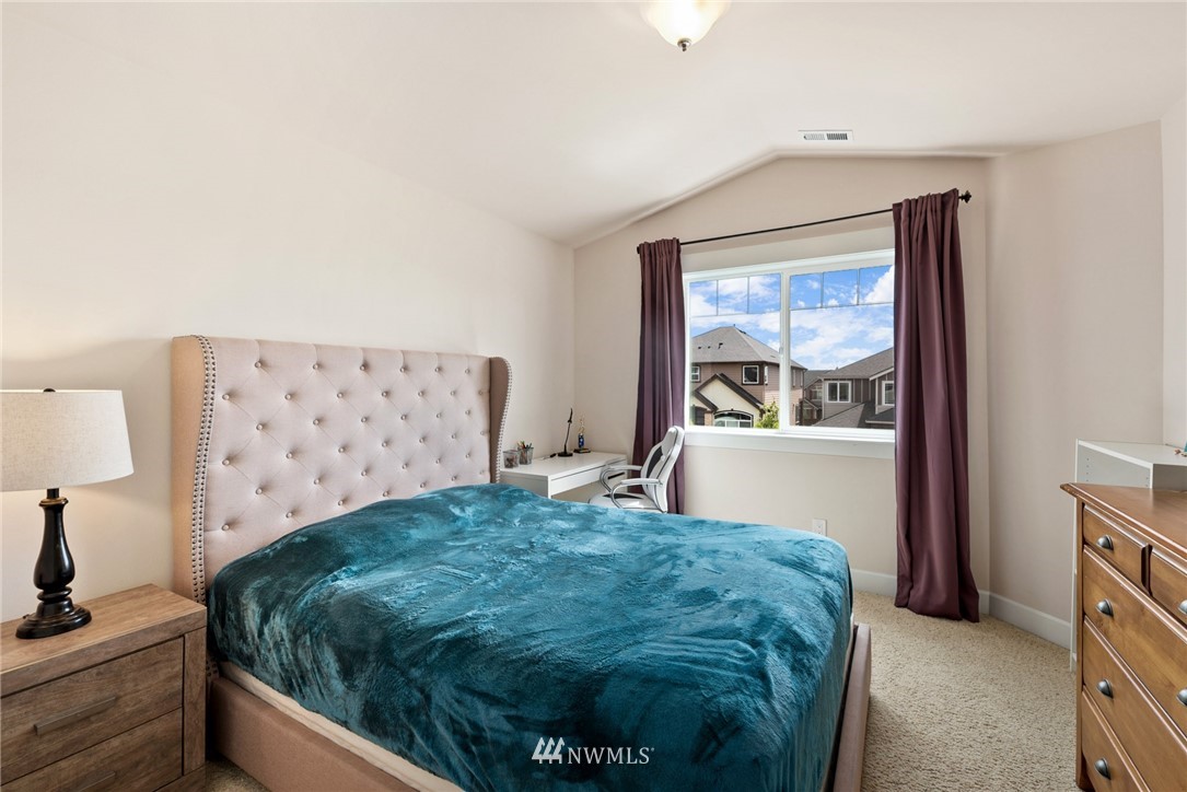 4113 172nd Place Southeast Bothell, WA 98012 - Photo 26 of 32 a bedroom with a bed and a window