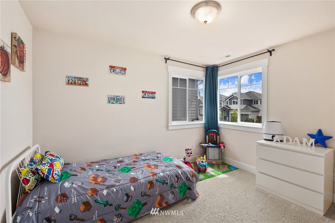 4113 172nd Place Southeast Bothell, WA 98012 - Photo 27 of 32 a bedroom with a bed and a window