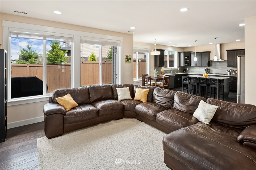 4113 172nd Place Southeast Bothell, WA 98012 - Photo 8 of 32 a living room with furniture and a large window