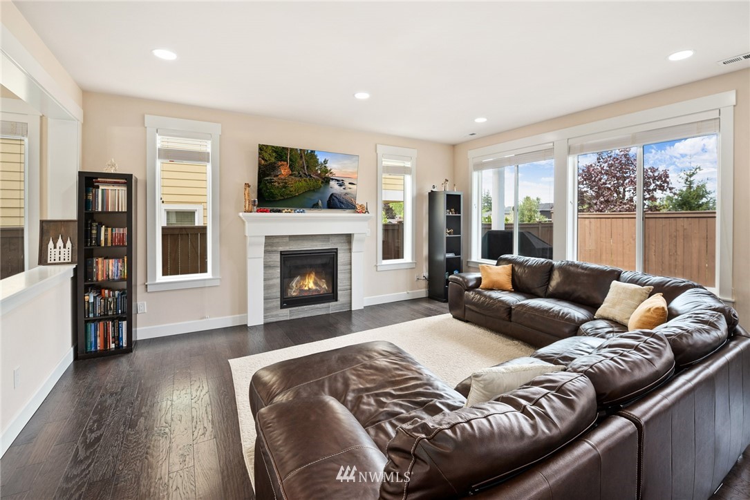 4113 172nd Place Southeast Bothell, WA 98012 - Photo 9 of 32 a living room with furniture fireplace and flat screen tv