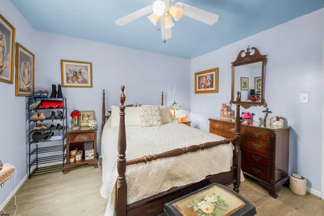 a bed room with a bed and a desk