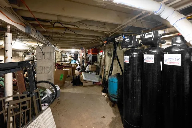 a view of a deck with couches table and chairs with wooden floor