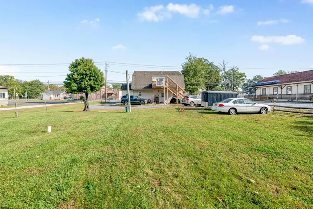 a view of a park with large trees