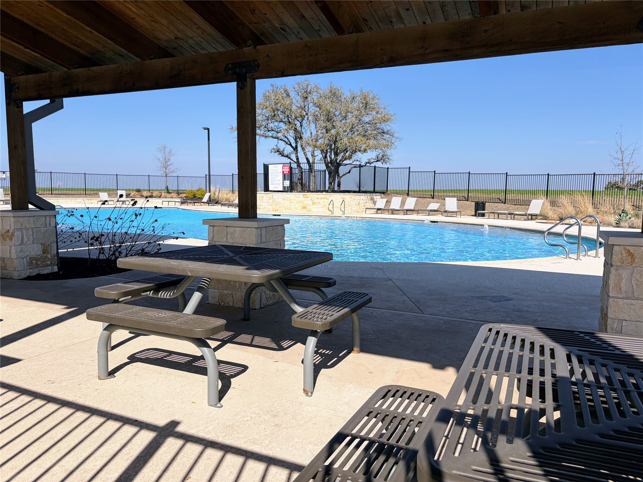 440 El Capitan Loop Dripping Springs, TX 78620 - Photo 21 of 22 Community pool featuring a patio area
