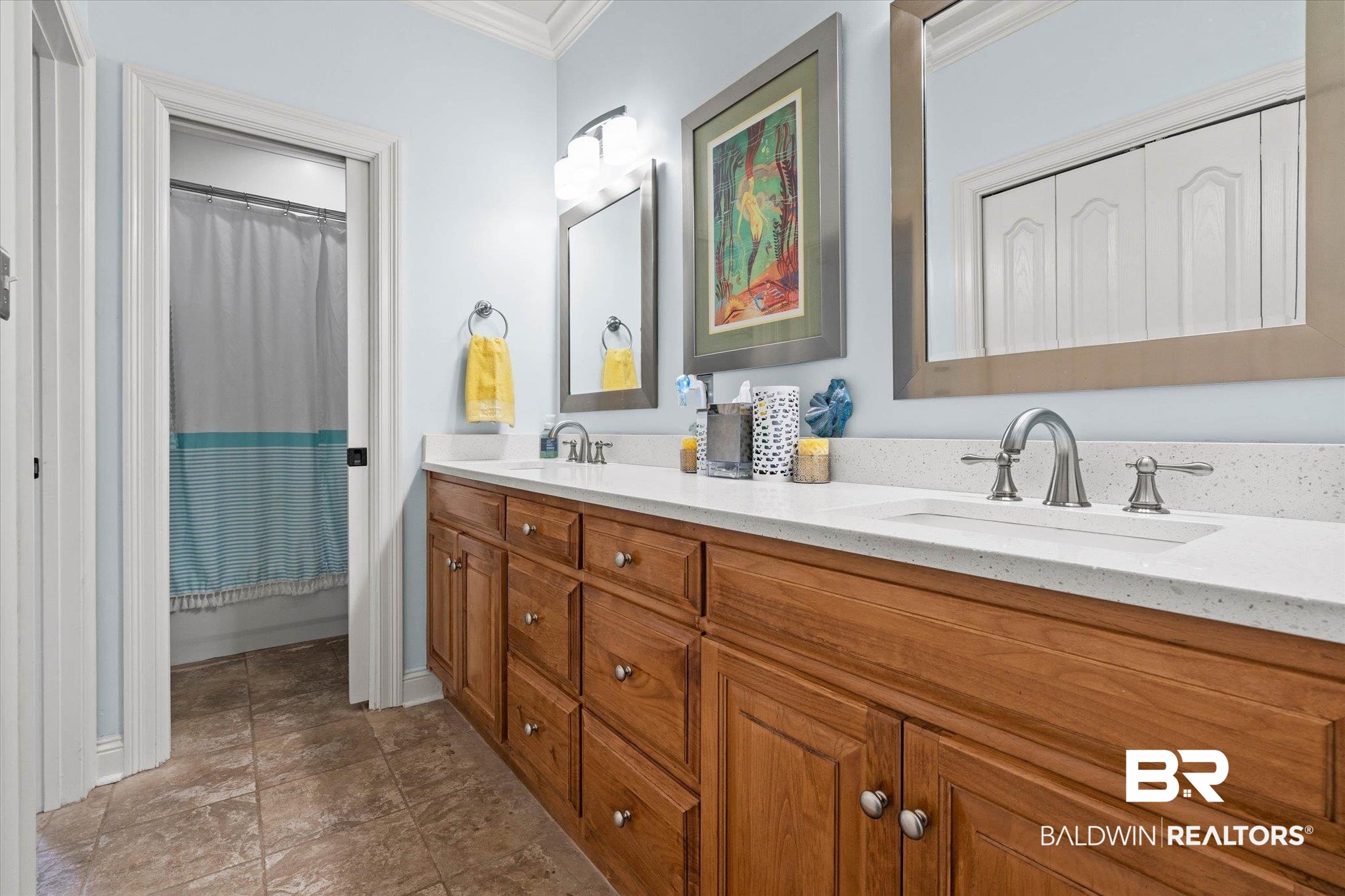 24908 Bosbyshell Avenue Daphne, AL 36526 - Photo 18 of 49 Bathroom featuring a double vanity with wood-finish cabinetry and light-colored countertops