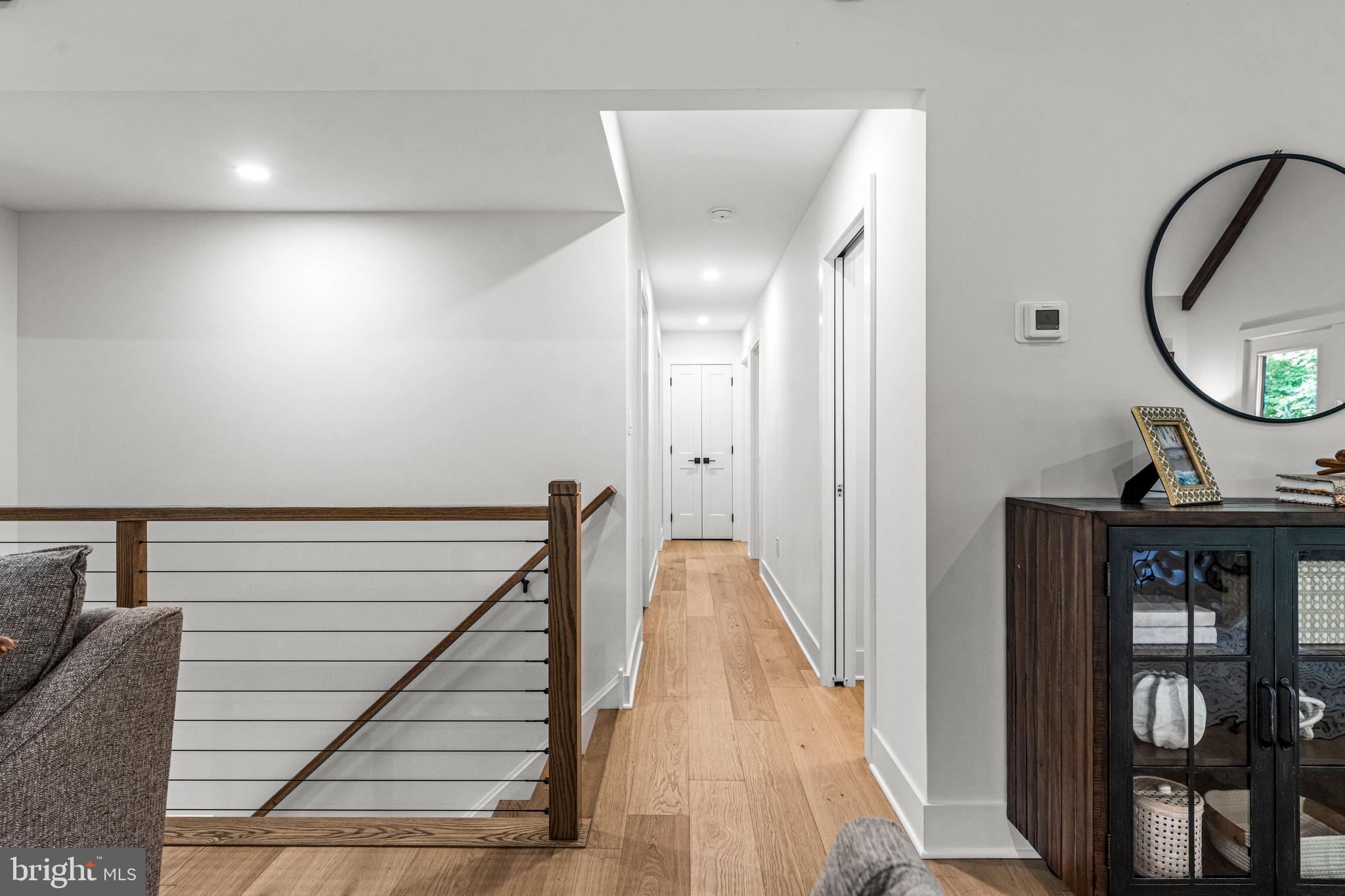 615 Cricklewood Road West Chester, PA 19382 - Photo 13 of 58 a view of a hallway with wooden floor and staircase