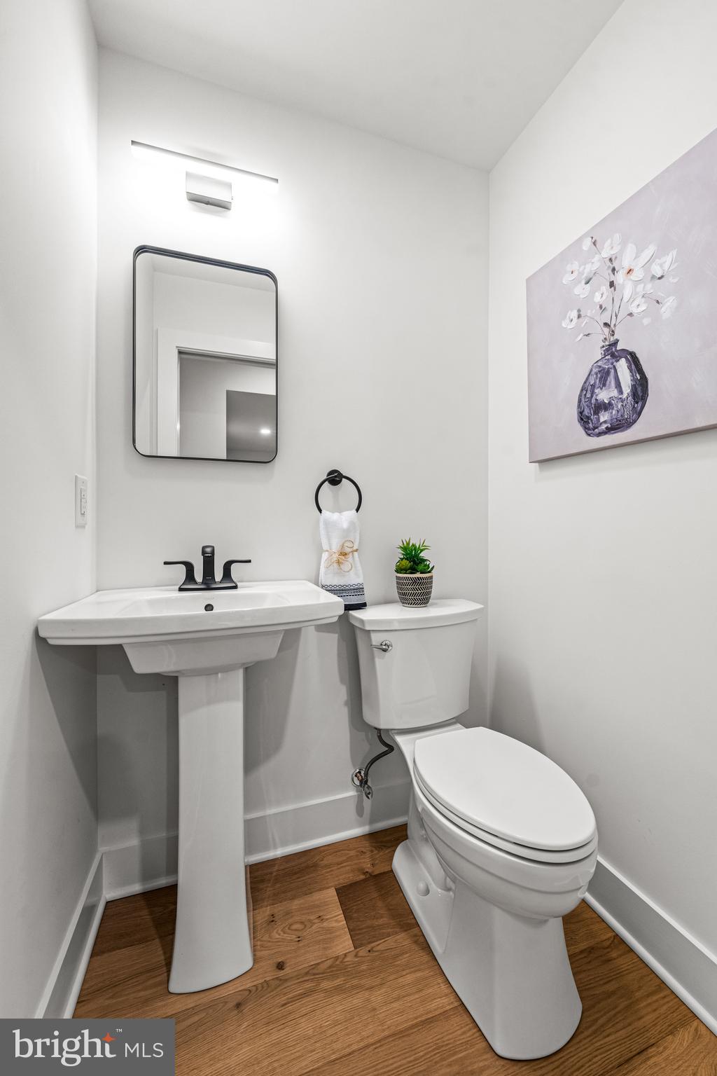 615 Cricklewood Road West Chester, PA 19382 - Photo 14 of 58 a bathroom with a toilet a sink and mirror