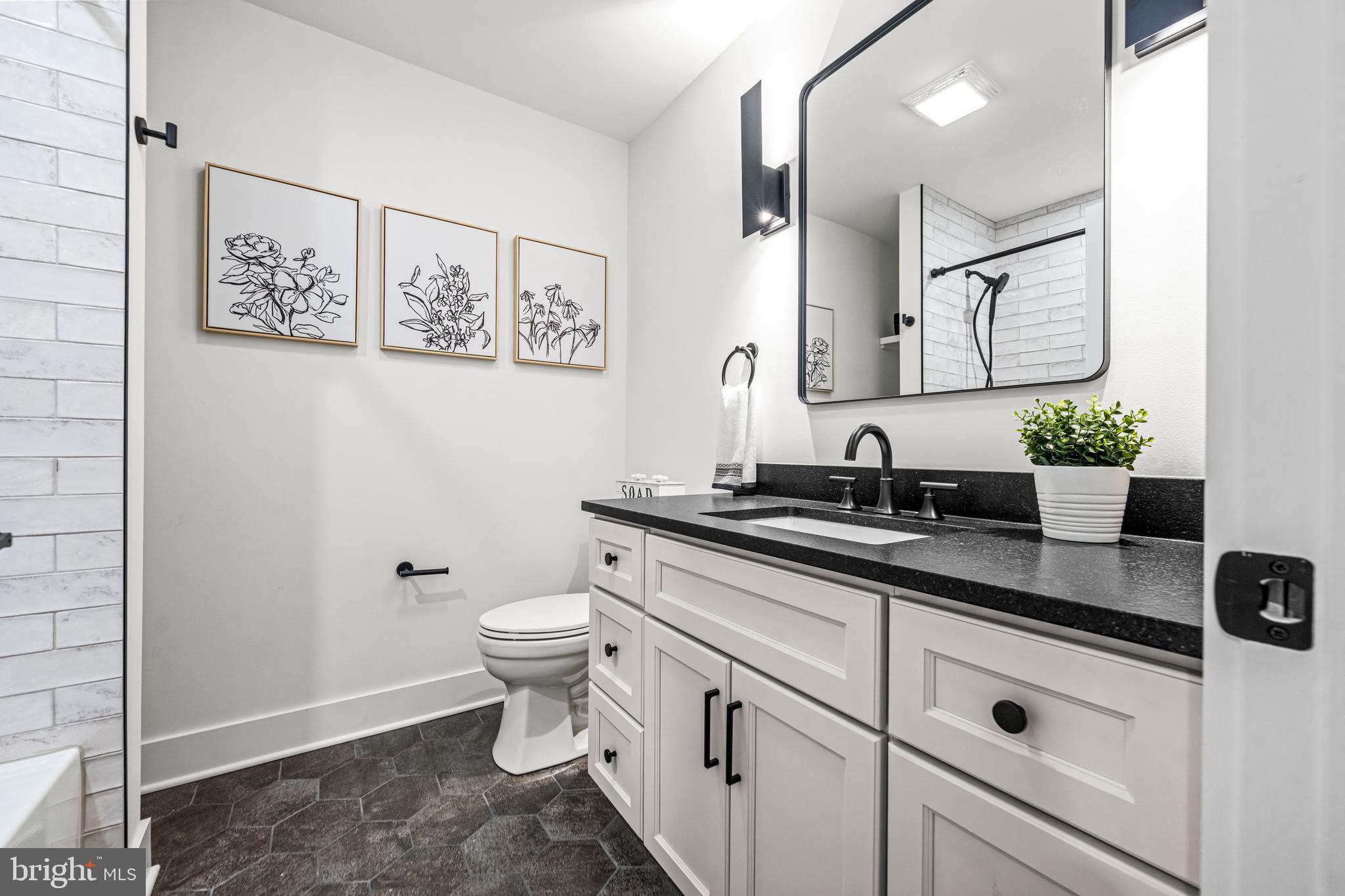615 Cricklewood Road West Chester, PA 19382 - Photo 16 of 58 a bathroom with a granite countertop sink mirror and toilet