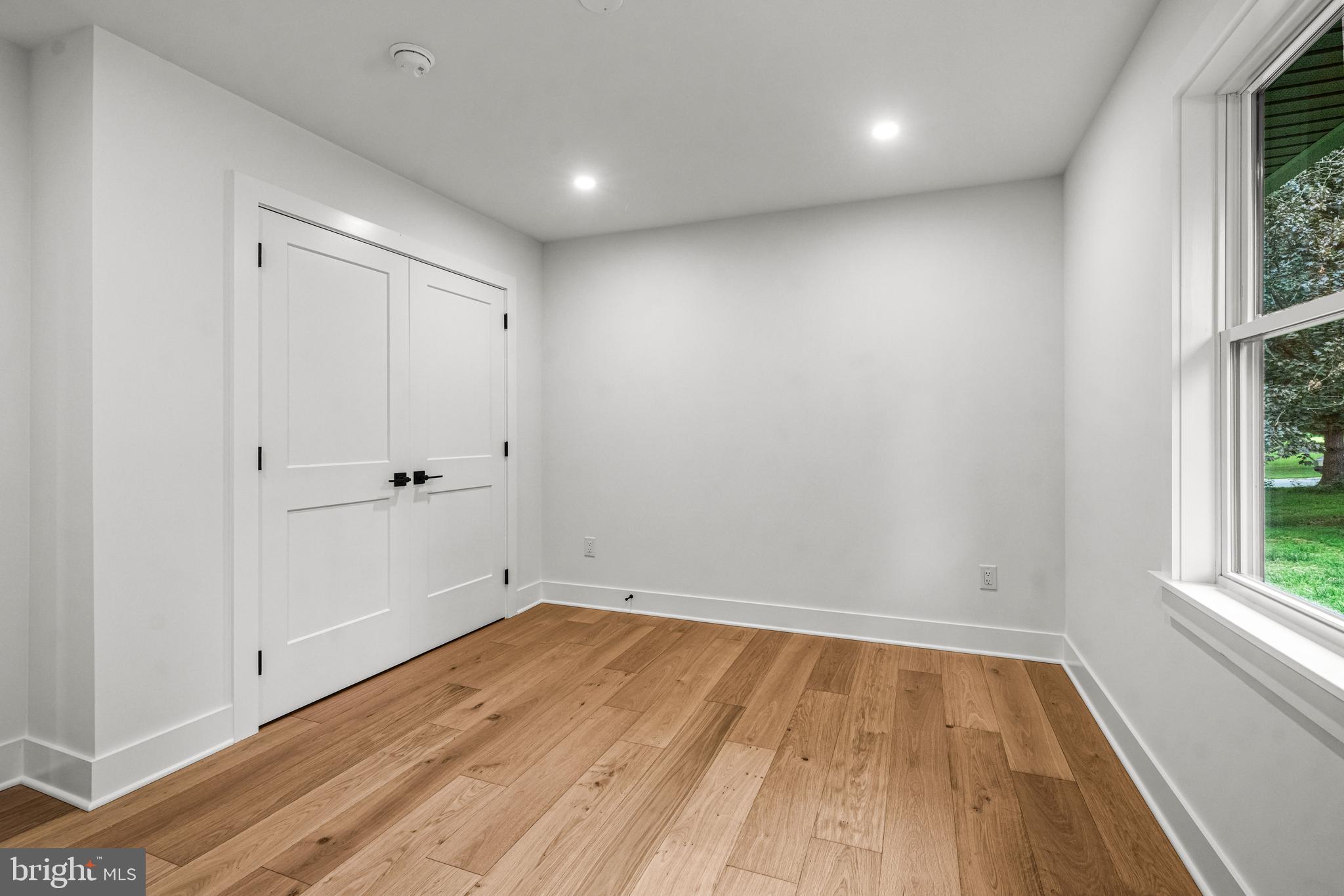615 Cricklewood Road West Chester, PA 19382 - Photo 19 of 58 wooden floor in an empty room with a window