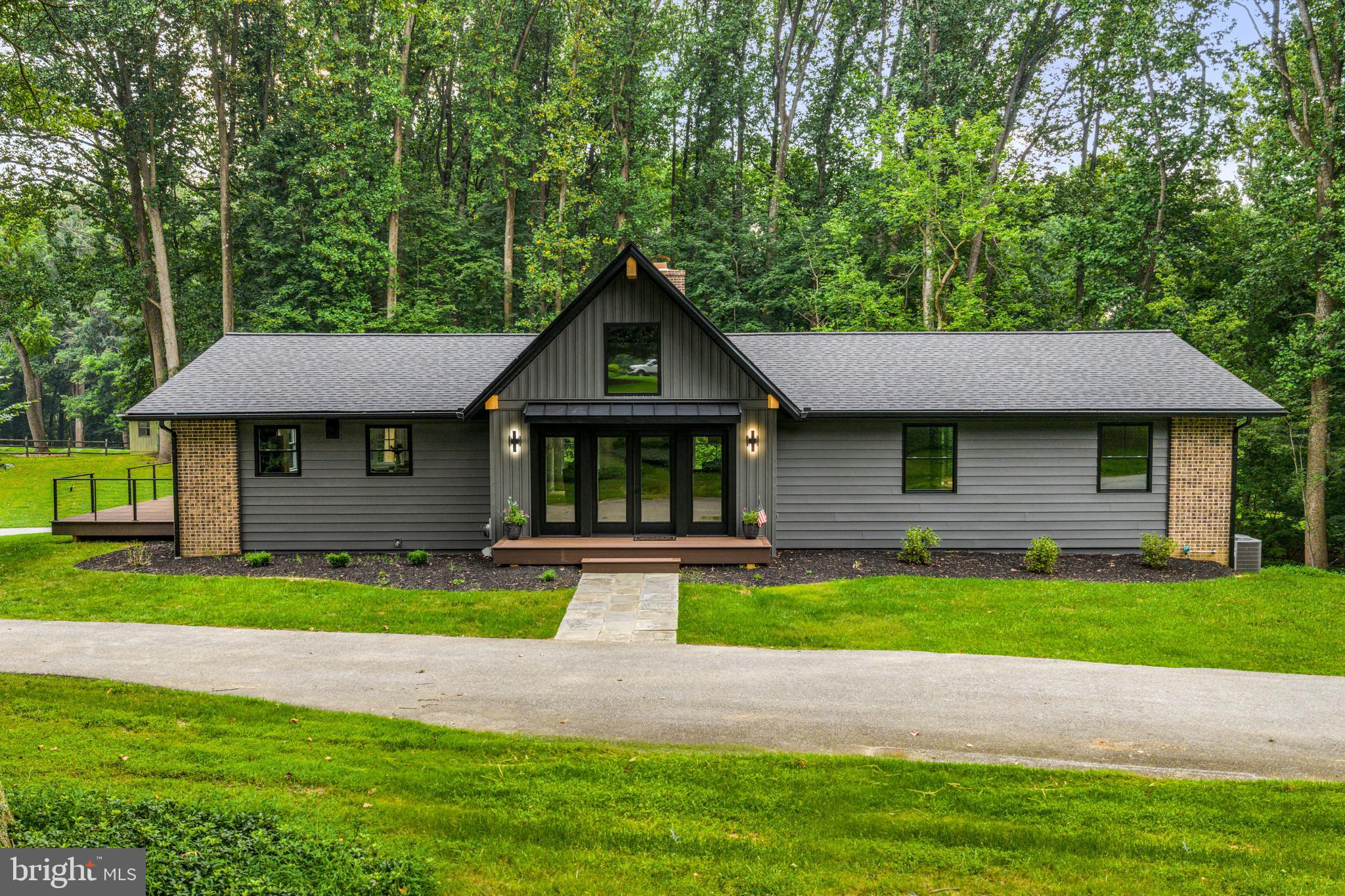 615 Cricklewood Road West Chester, PA 19382 - Photo 2 of 58 a front view of a house with a yard and trees