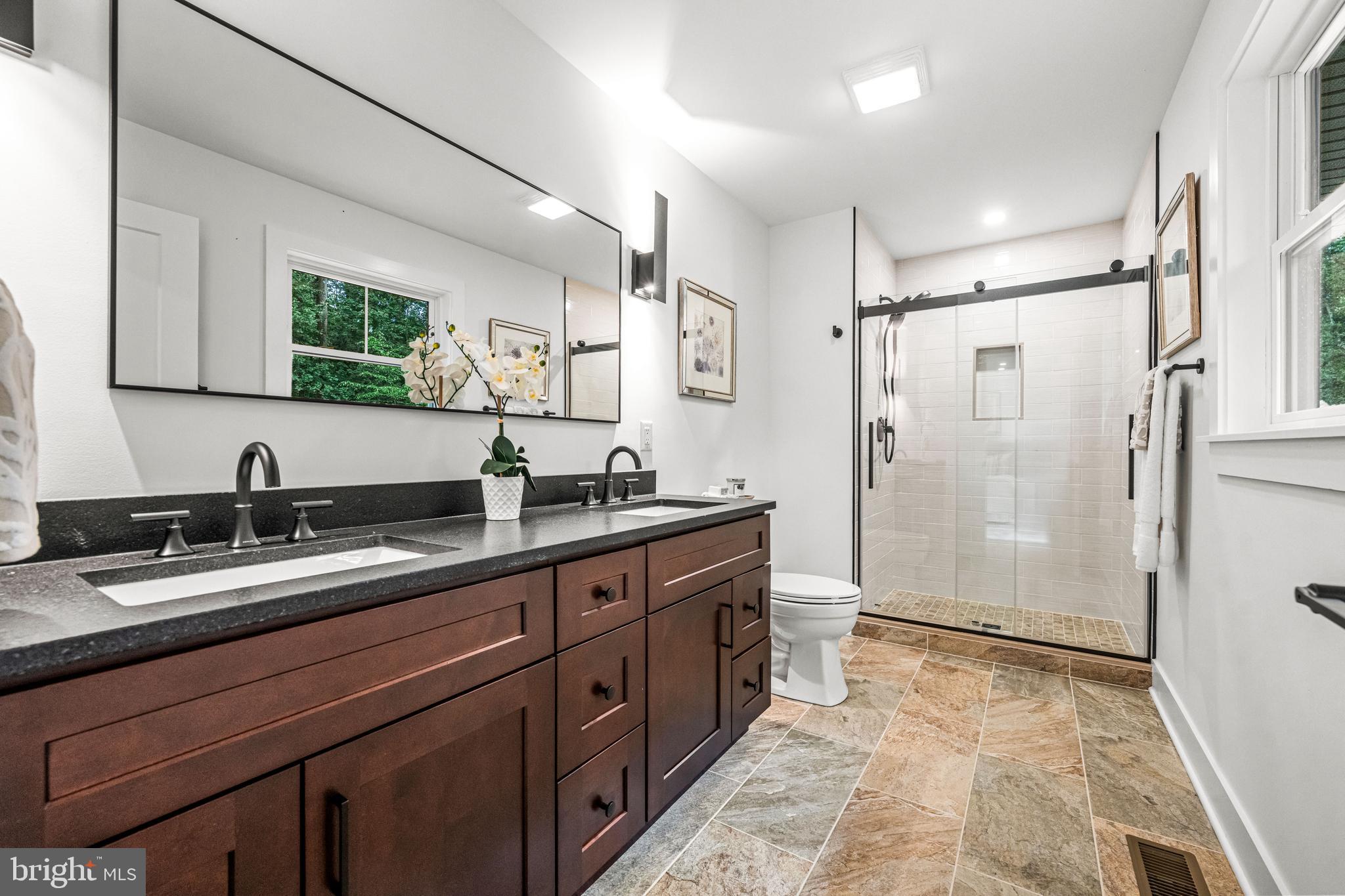 615 Cricklewood Road West Chester, PA 19382 - Photo 24 of 58 a spacious bathroom with a double vanity sink mirror double shower and a bathtub