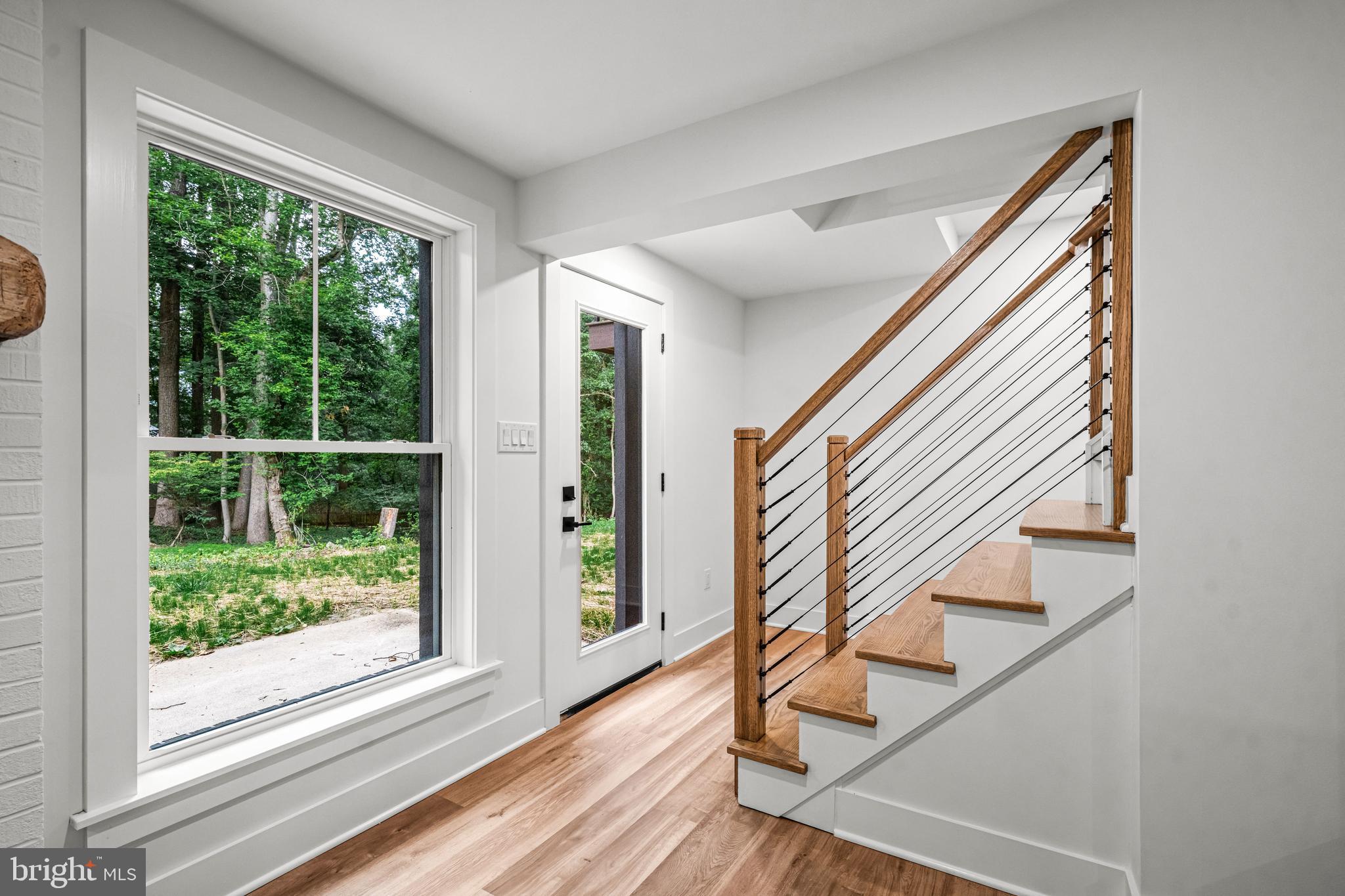 615 Cricklewood Road West Chester, PA 19382 - Photo 26 of 58 a view of front door with wooden floor and stairs