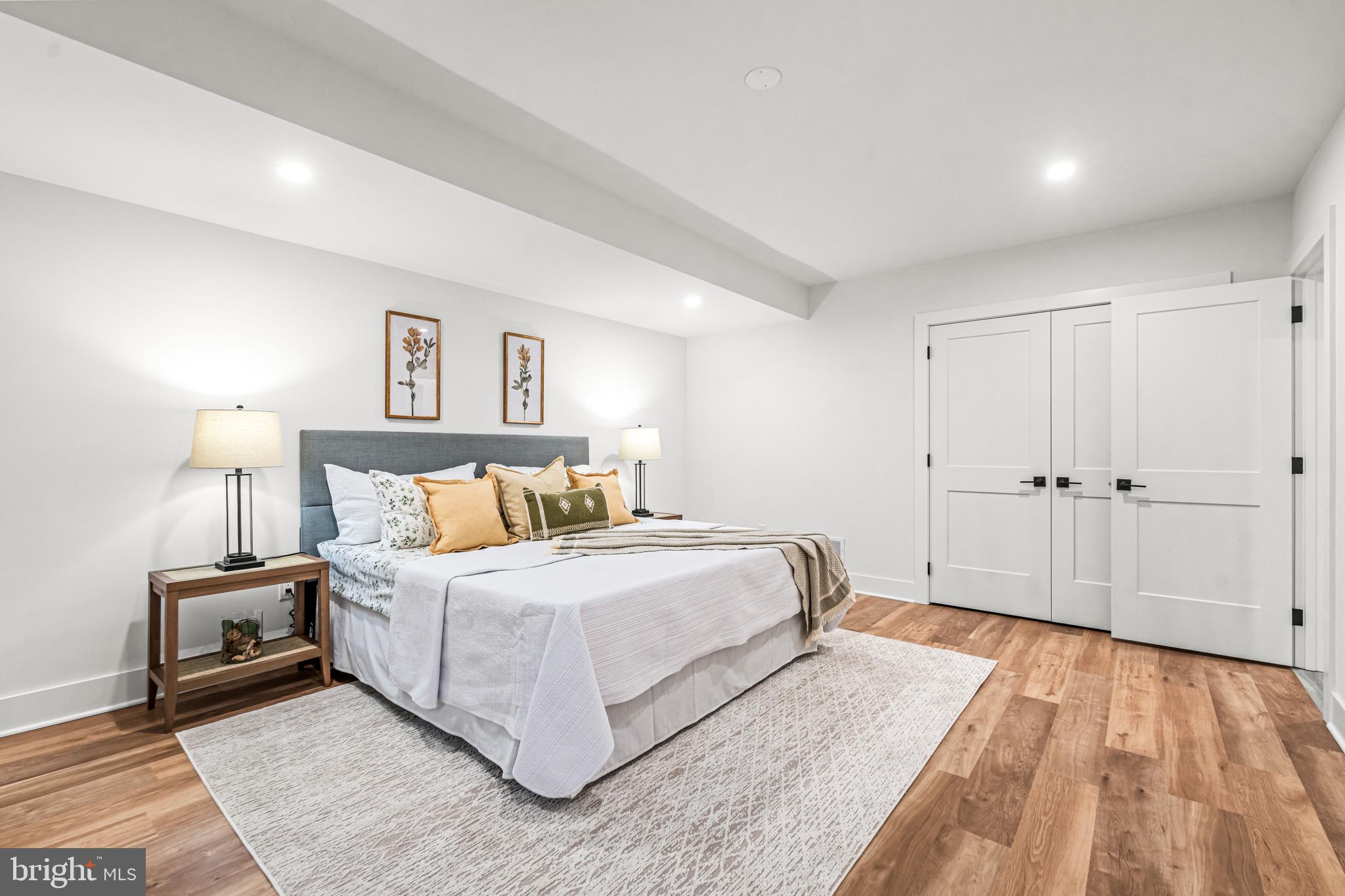 615 Cricklewood Road West Chester, PA 19382 - Photo 31 of 58 a spacious bedroom with a bed and a lamp