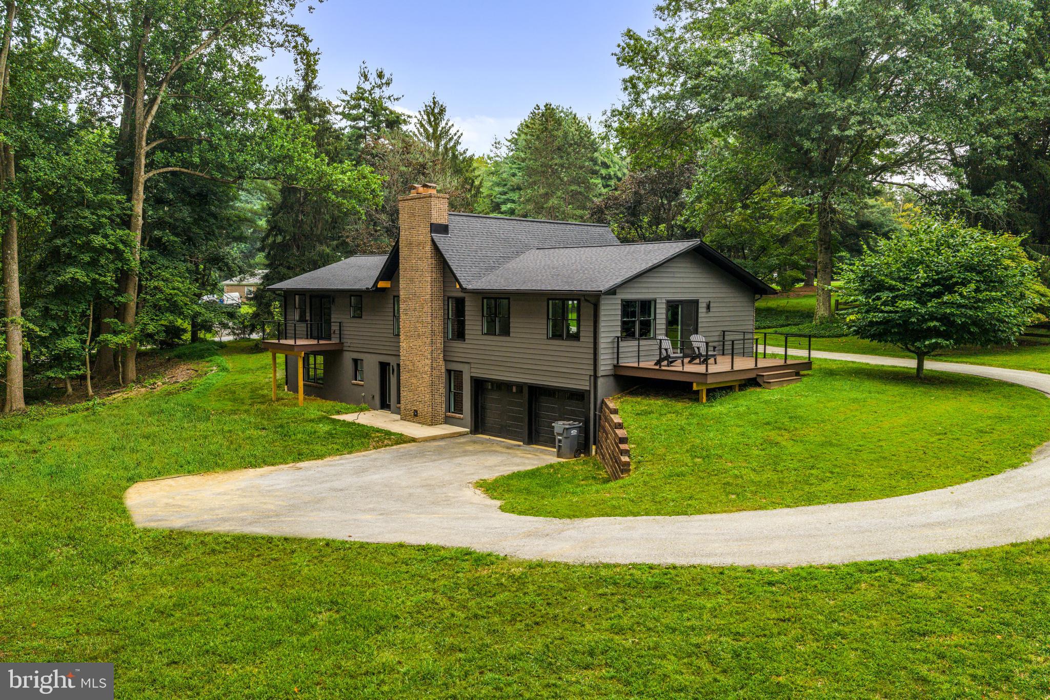 615 Cricklewood Road West Chester, PA 19382 - Photo 47 of 58 a front view of a house with a garden