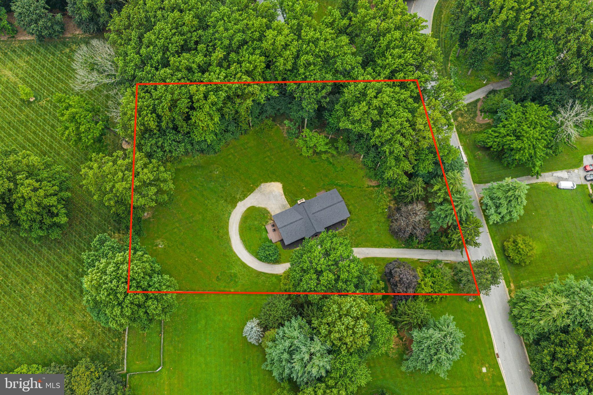 615 Cricklewood Road West Chester, PA 19382 - Photo 49 of 58 an aerial view of a house with a yard and trees all around