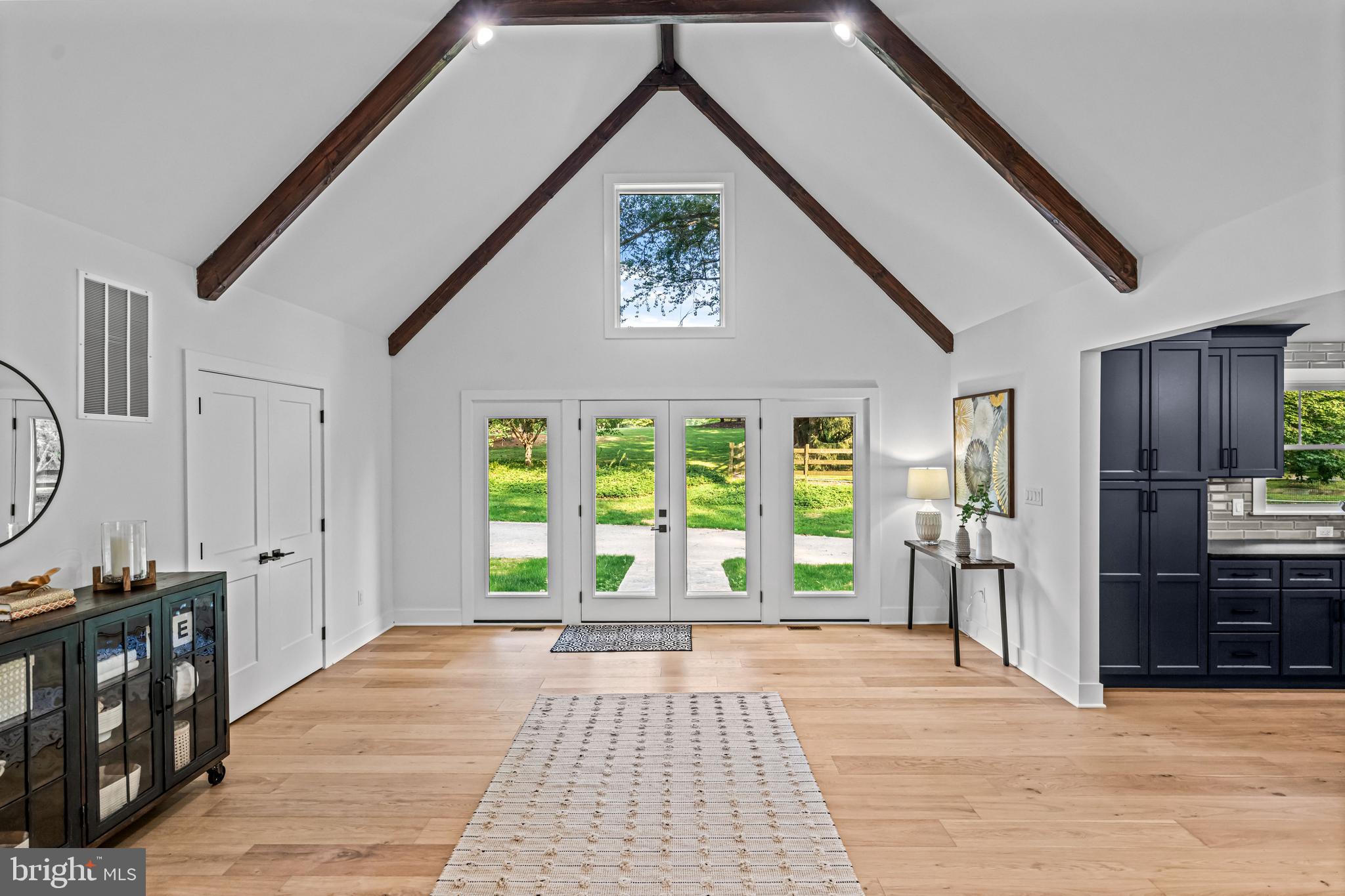 615 Cricklewood Road West Chester, PA 19382 - Photo 5 of 58 a view of a hallway with wooden floor and windows