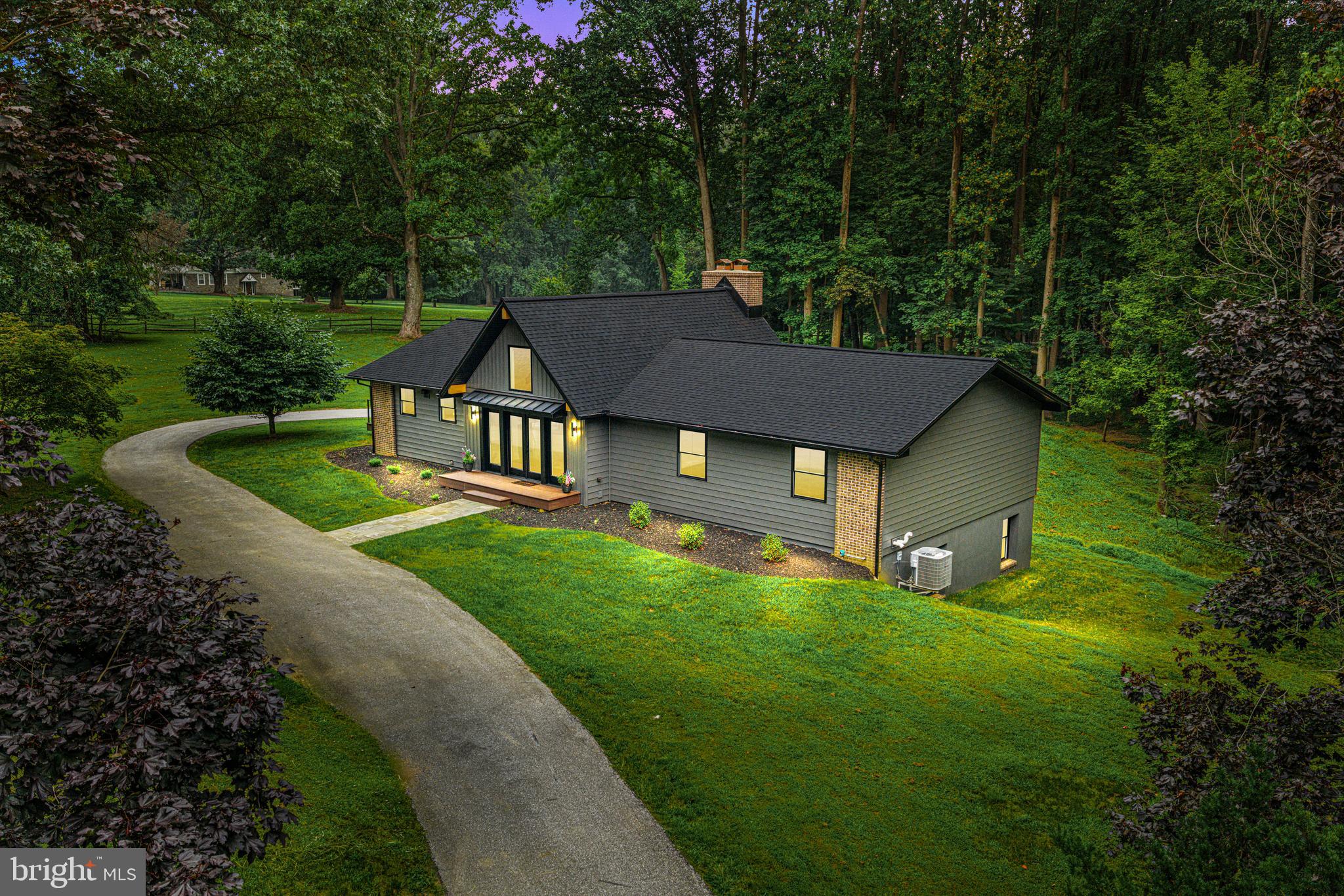 615 Cricklewood Road West Chester, PA 19382 - Photo 55 of 58 a aerial view of a house with a yard table and chairs