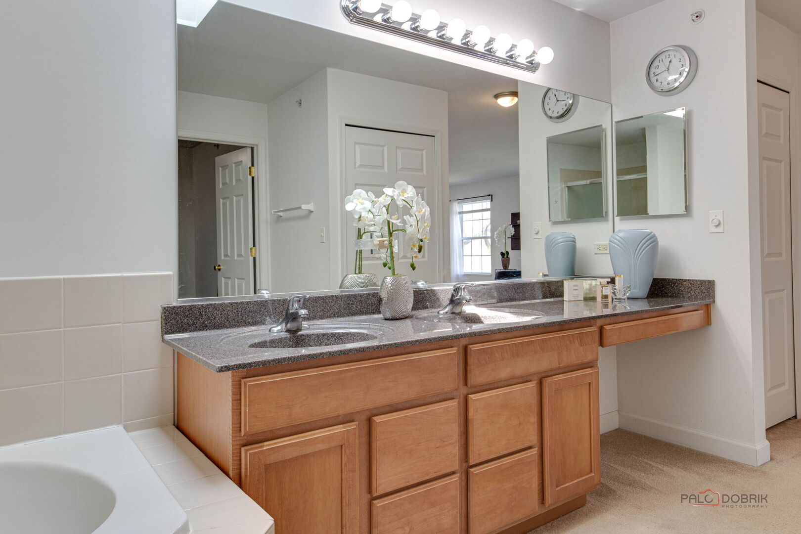 1330 Horizon Trail Wheeling, IL 60090 - Photo 25 of 39 a bathroom with a granite countertop sink a large mirror and a