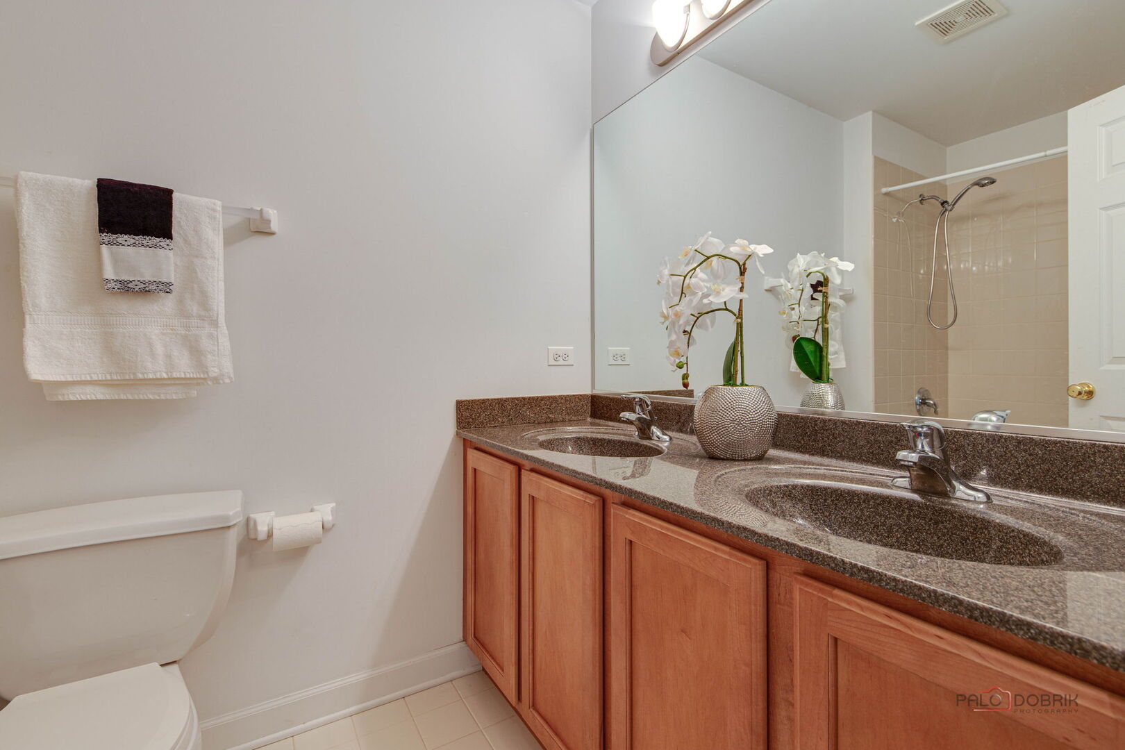 1330 Horizon Trail Wheeling, IL 60090 - Photo 29 of 39 a bathroom with a granite countertop sink a toilet and a mirror