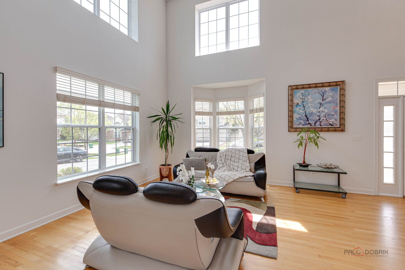 1330 Horizon Trail Wheeling, IL 60090 - Photo 6 of 39 a living room with furniture a wooden floor and a large window