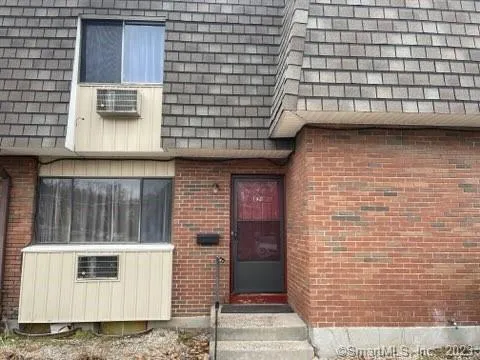 a brick house with a door